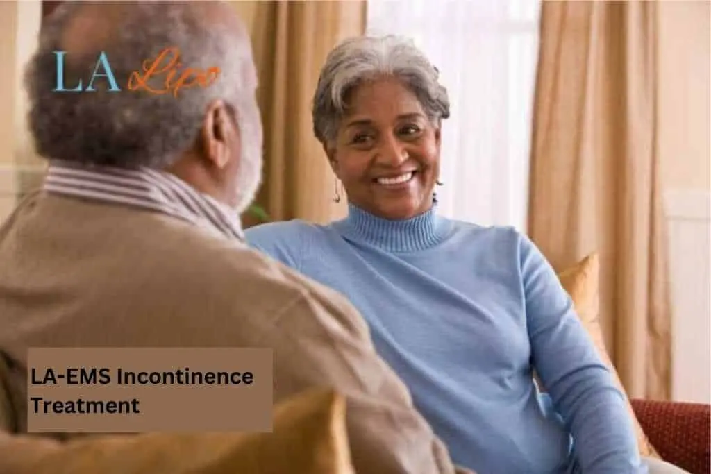Couple sat smiling at each other - LA-EMS treatment Brighton and Hove