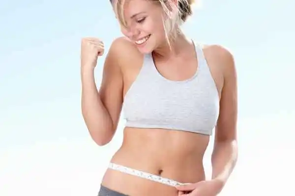 woman happy after fat reduction treatment Brighton and Hove