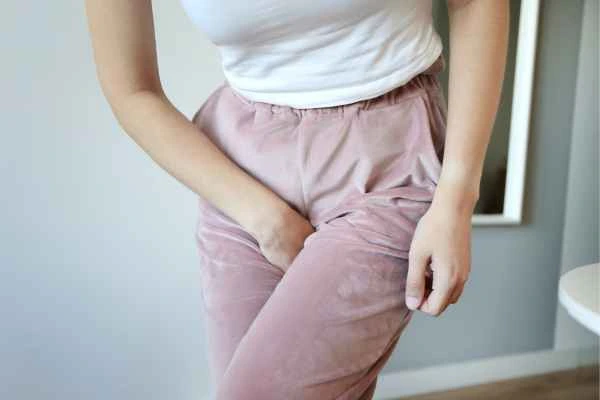 woman struggling with urine incontinence Brighton and Hove